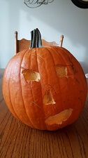 Curved Pumpkin. Two eyes a nose and a mouth.